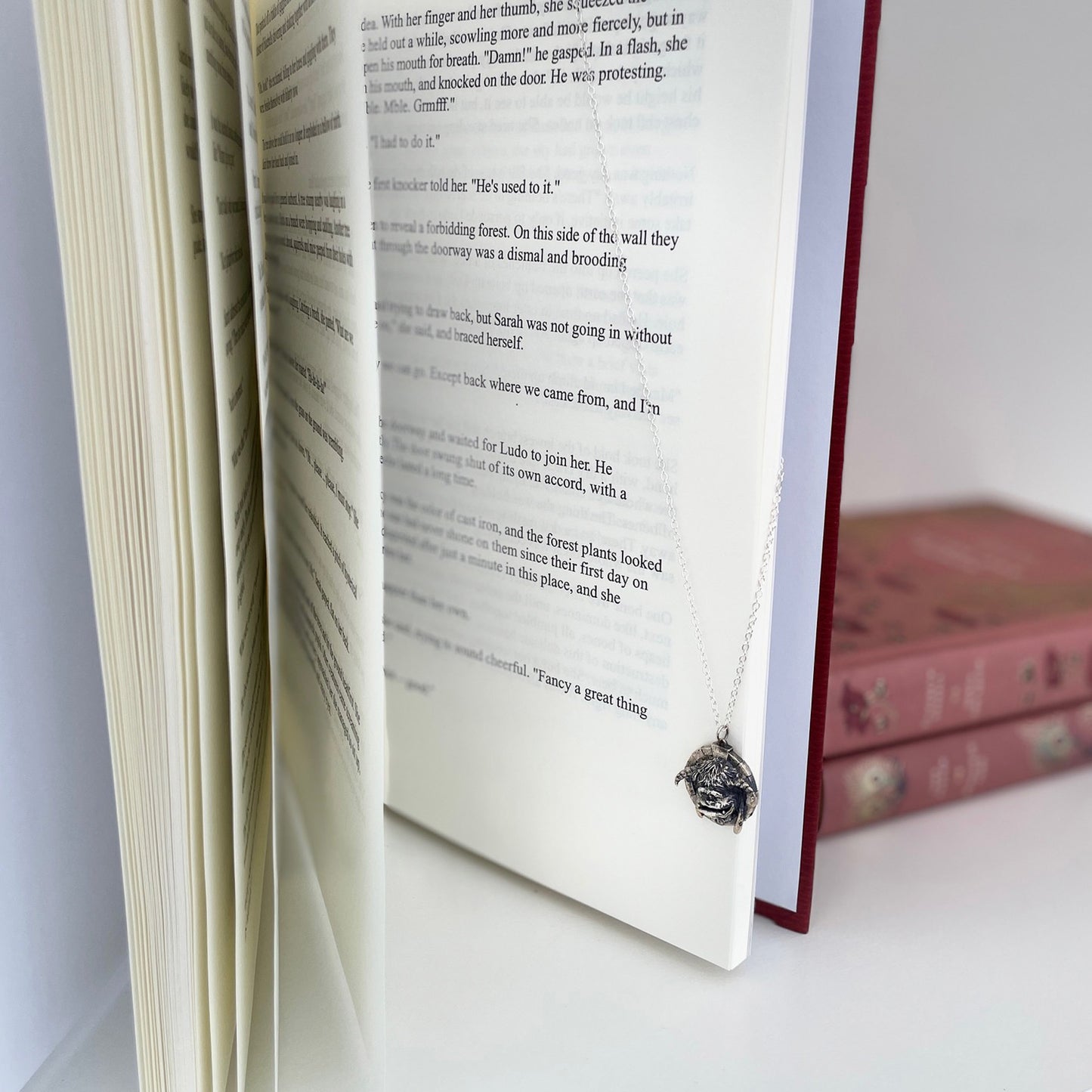 Books with Charm | Jim Henson's Labyrinth Movie A4 hardback illustrated book and Sterling Silver Ludo Charm Necklace. Book Gift Sets from £99.95